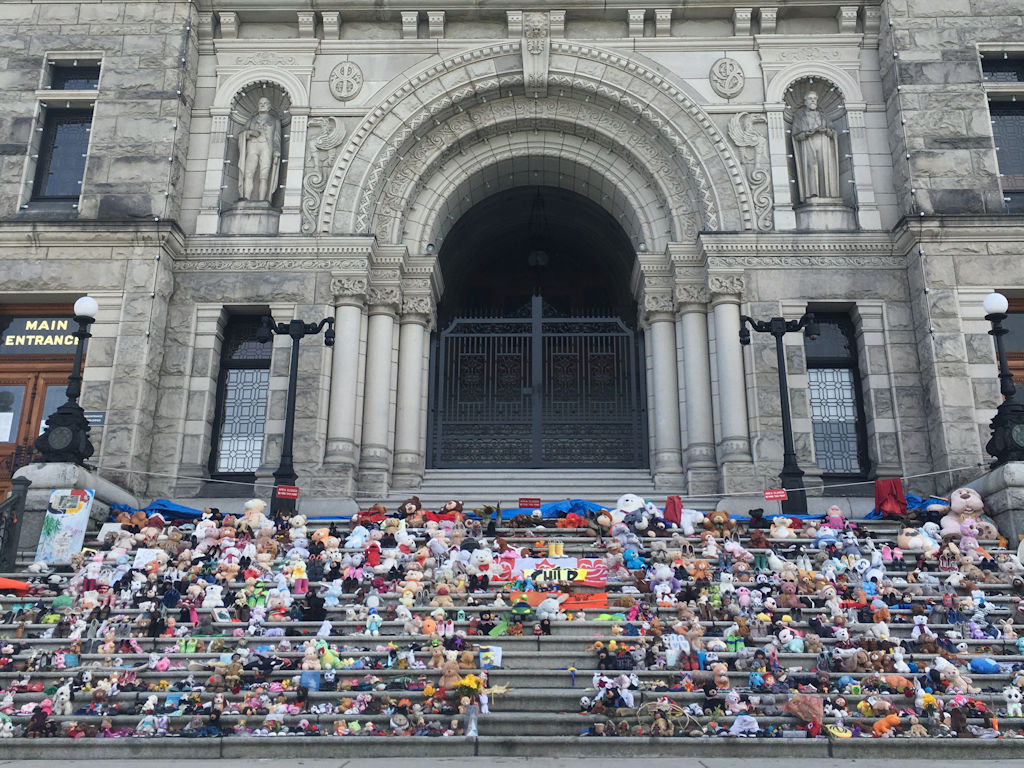 Victoria BC parliament building steps covered in toys for Truth and Reconciliation day in honour of the first nations children