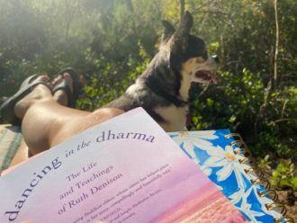 photo of christina's feet and reading with her puppy Presley at the end