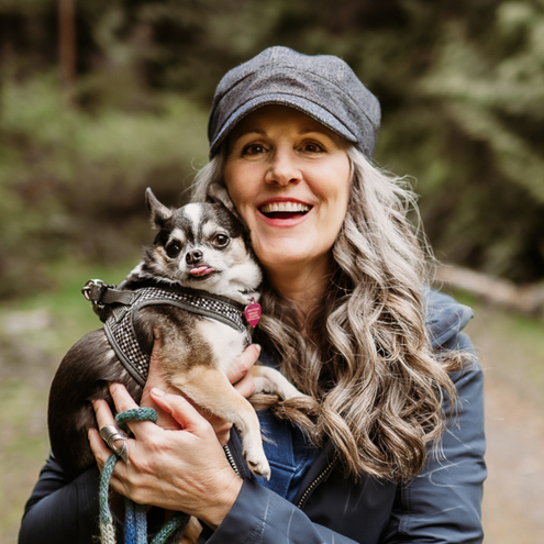 Christina Merkley with her puppy Presley on a walk in the forest