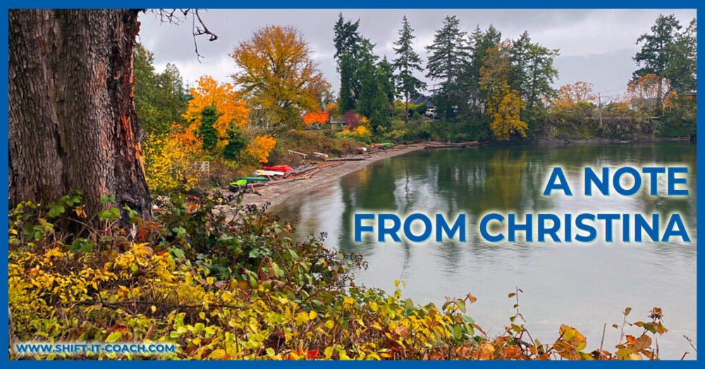 Beautiful fall colours on Saltspring Island. Bright yellows and oranges along a still lake with moody grey clouded sky. Rainforests of Vancouver Island