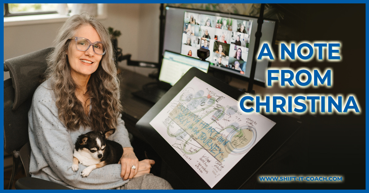 Christina Merkley in a gray sweater with puppy Presley on her lap smiles at the camera with her drawing tablet and course group on the computer in the background.