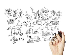 hand sketching doodles on a whiteboard